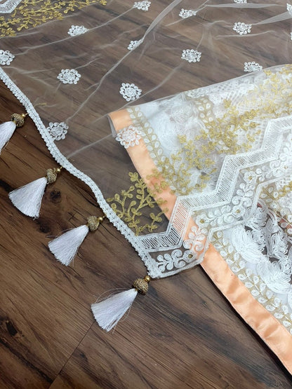 Peach and white soft net heavy embroidered lehenga choli