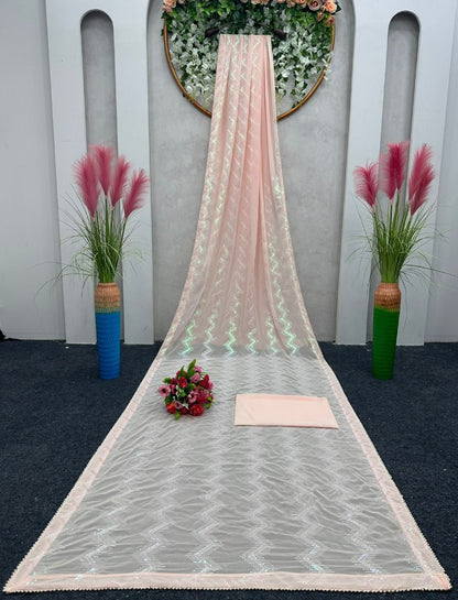 Peach georgette heavy thread sequence work saree