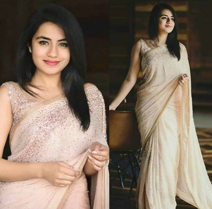 Peach georgette pearl and sequence worked saree