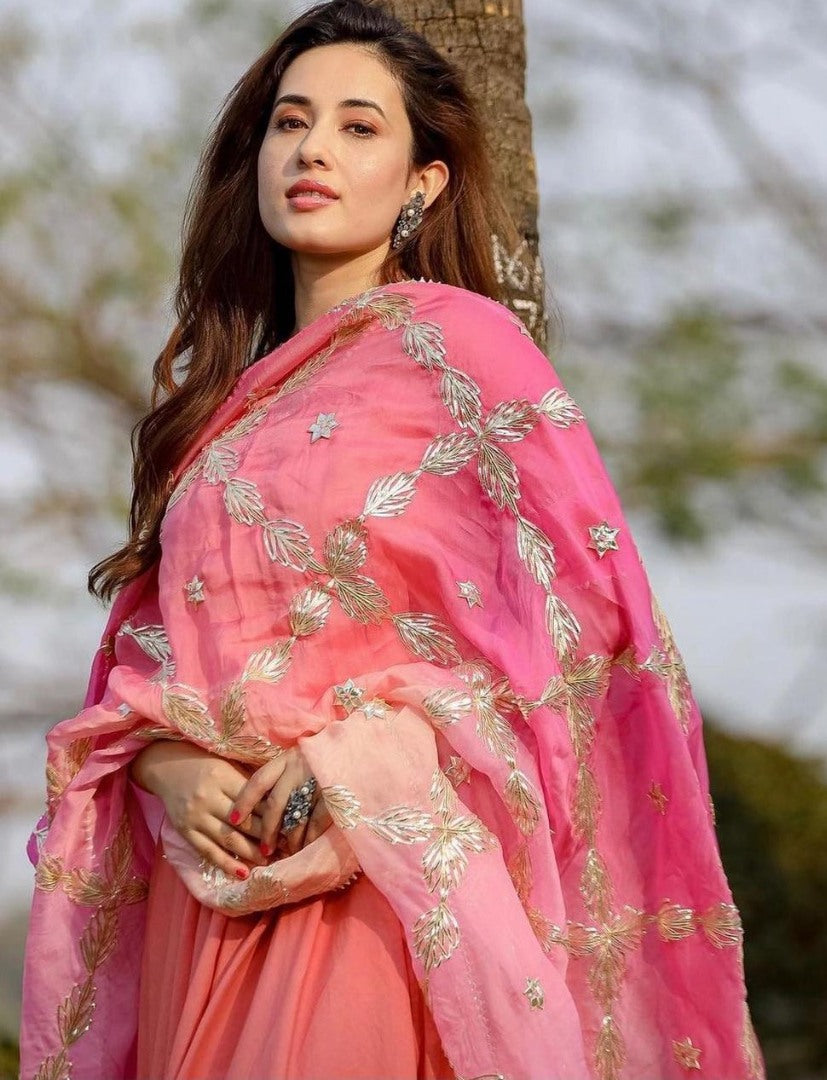 Peach heavy georgette flared gown with embroidered dupatta