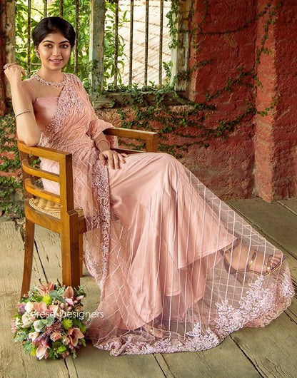 Peach mono net embroidery worked designer saree
