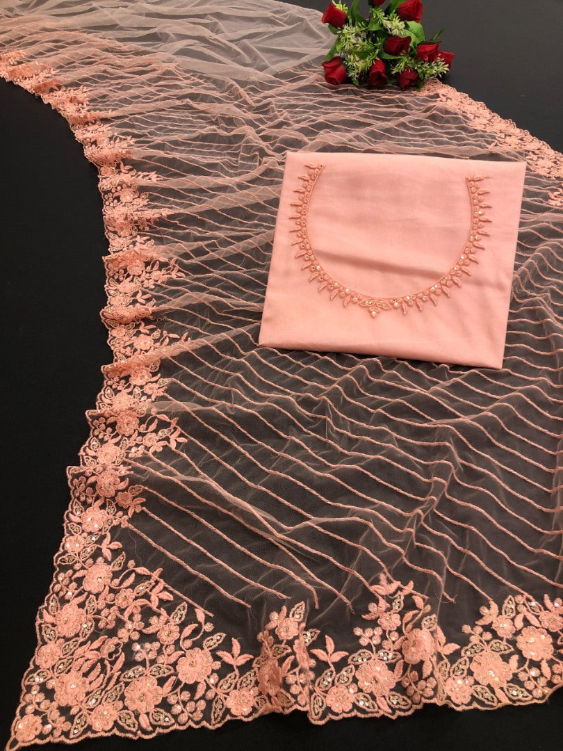 Peach mono net embroidery worked designer saree