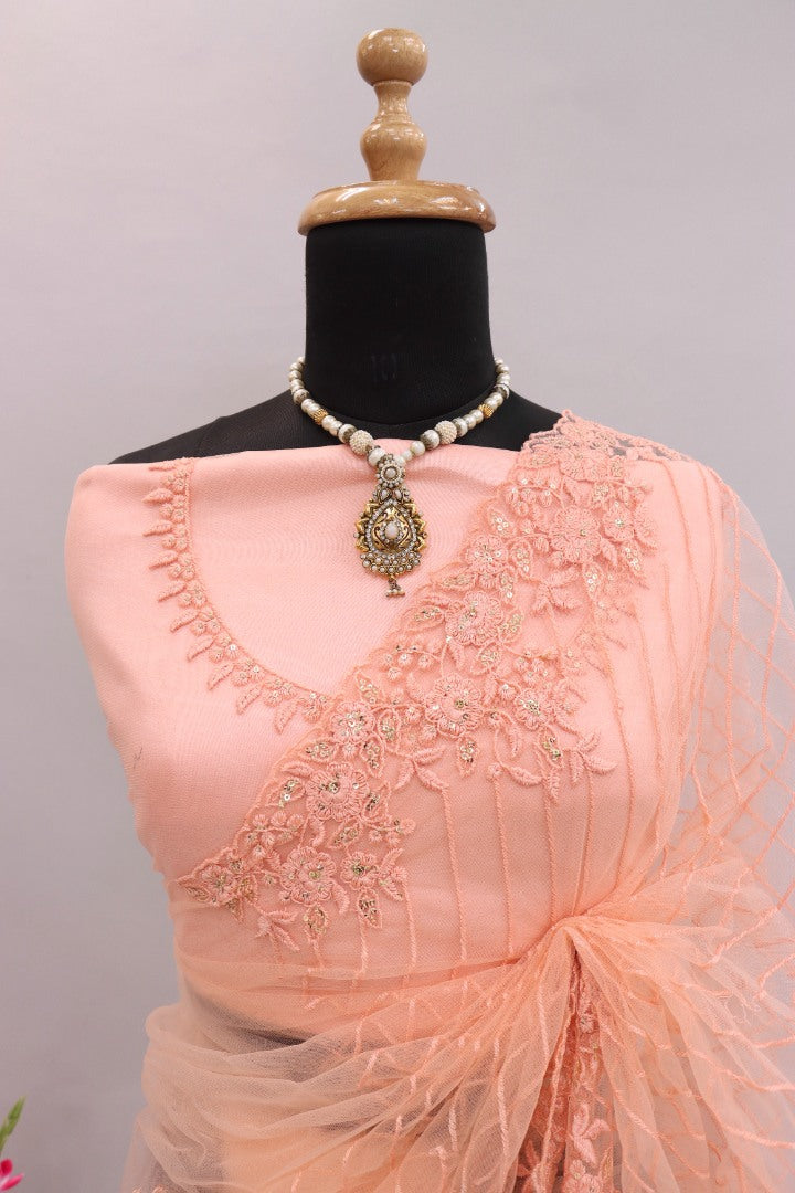 Peach mono net embroidery worked designer saree