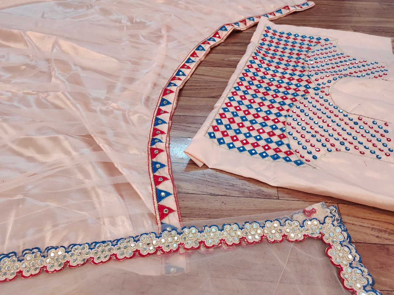 Peach mono net lehenga for ceremony