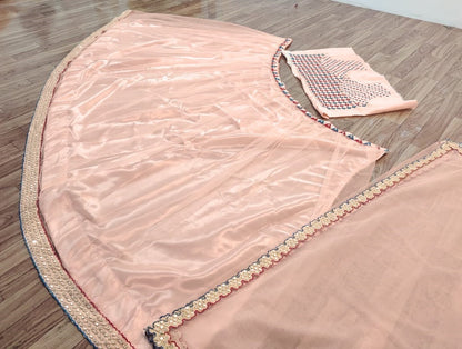 Peach mono net lehenga for ceremony