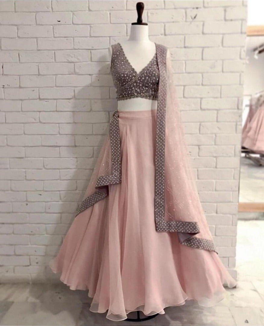 Peach net ceremonial lehenga choli