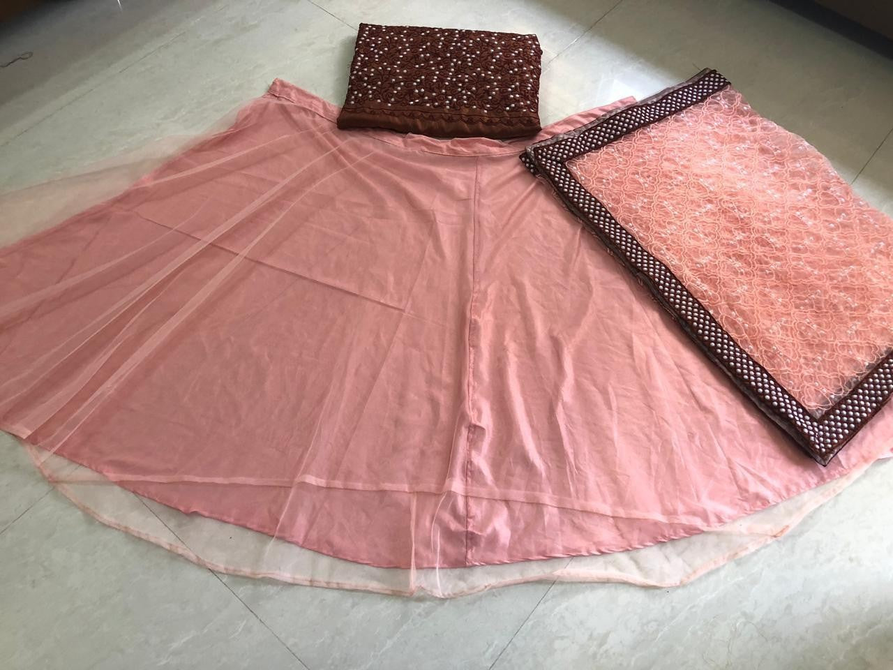 Peach net ceremonial lehenga choli