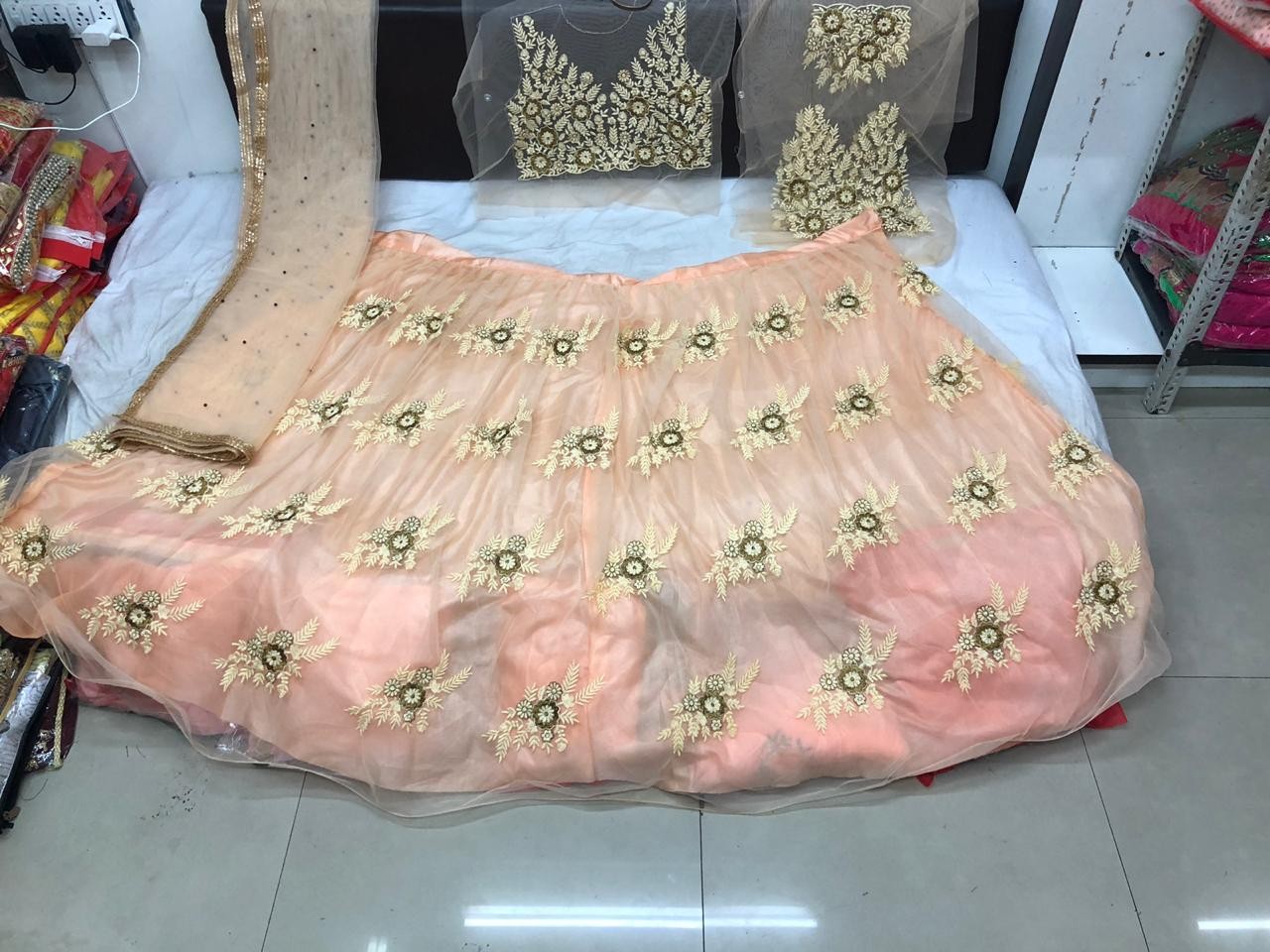 peach net heavy embroidery threadwork wedding lehenga choli