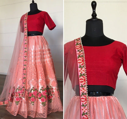 Peach net sequence embroidered ceremonial lehenga choli