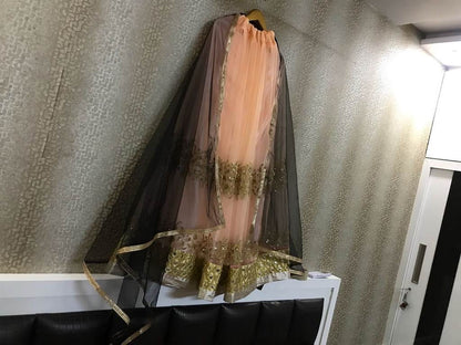 peach net sequence embroidered partywear lehenga
