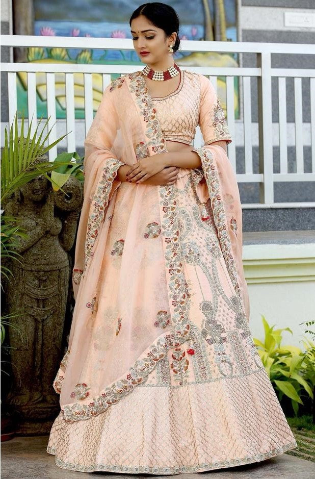 peach raw silk heavy embroidered bridal lehenga