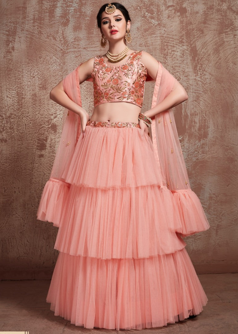 Peach soft net beautiful ruffle layer lehenga for ceremony