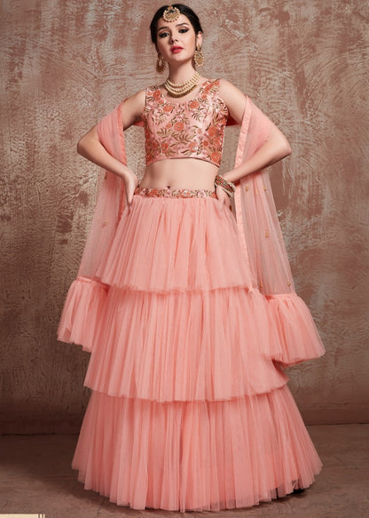 Peach soft net beautiful ruffle layer lehenga for ceremony