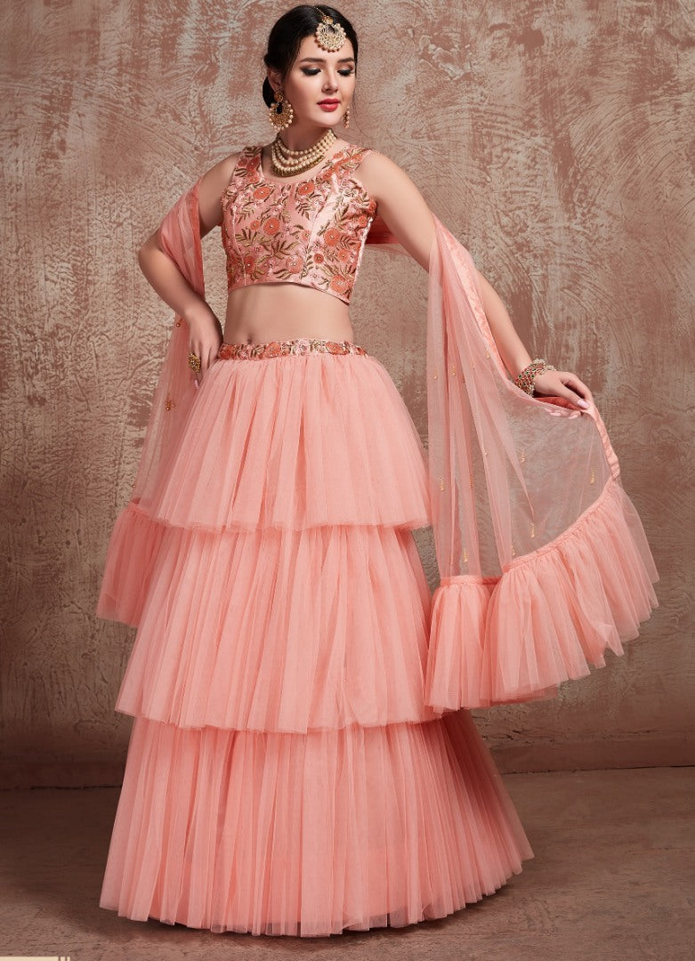 Peach soft net beautiful ruffle layer lehenga for ceremony