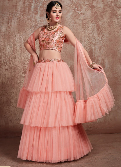 Peach soft net beautiful ruffle layer lehenga for ceremony