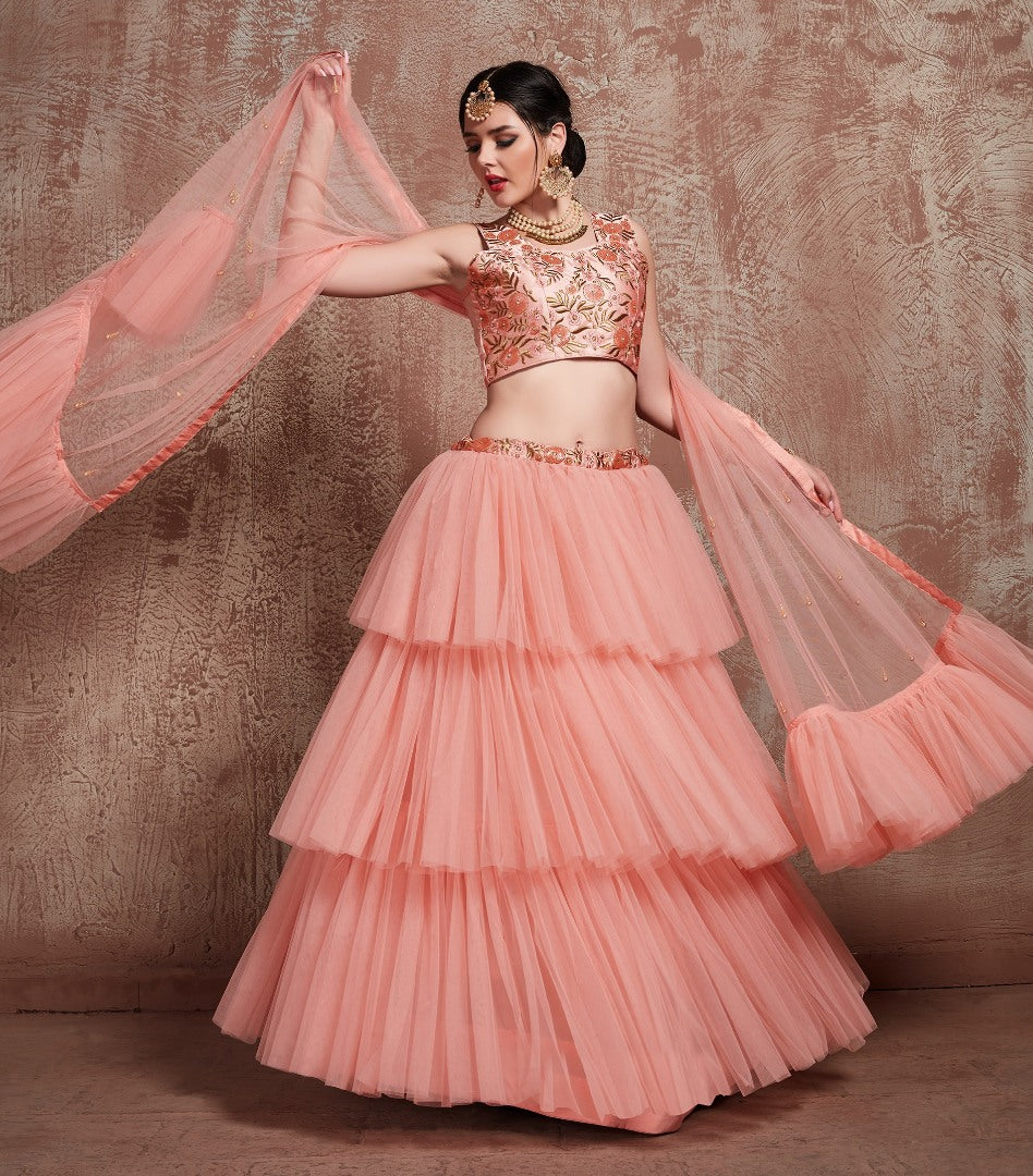 Peach soft net beautiful ruffle layer lehenga for ceremony