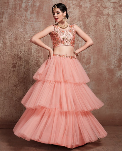 Peach soft net beautiful ruffle layer lehenga for ceremony
