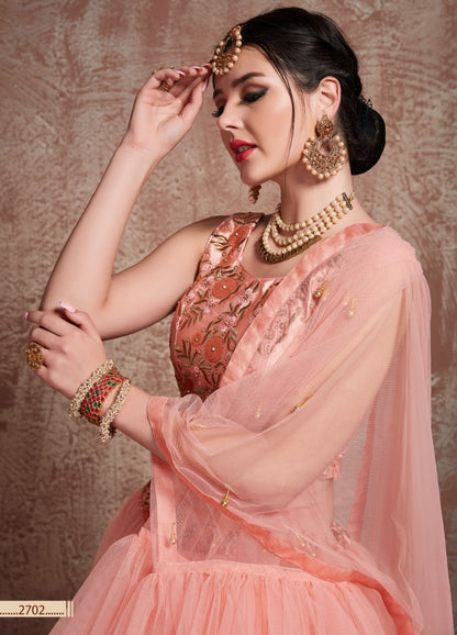 Peach soft net beautiful ruffle layer lehenga for ceremony