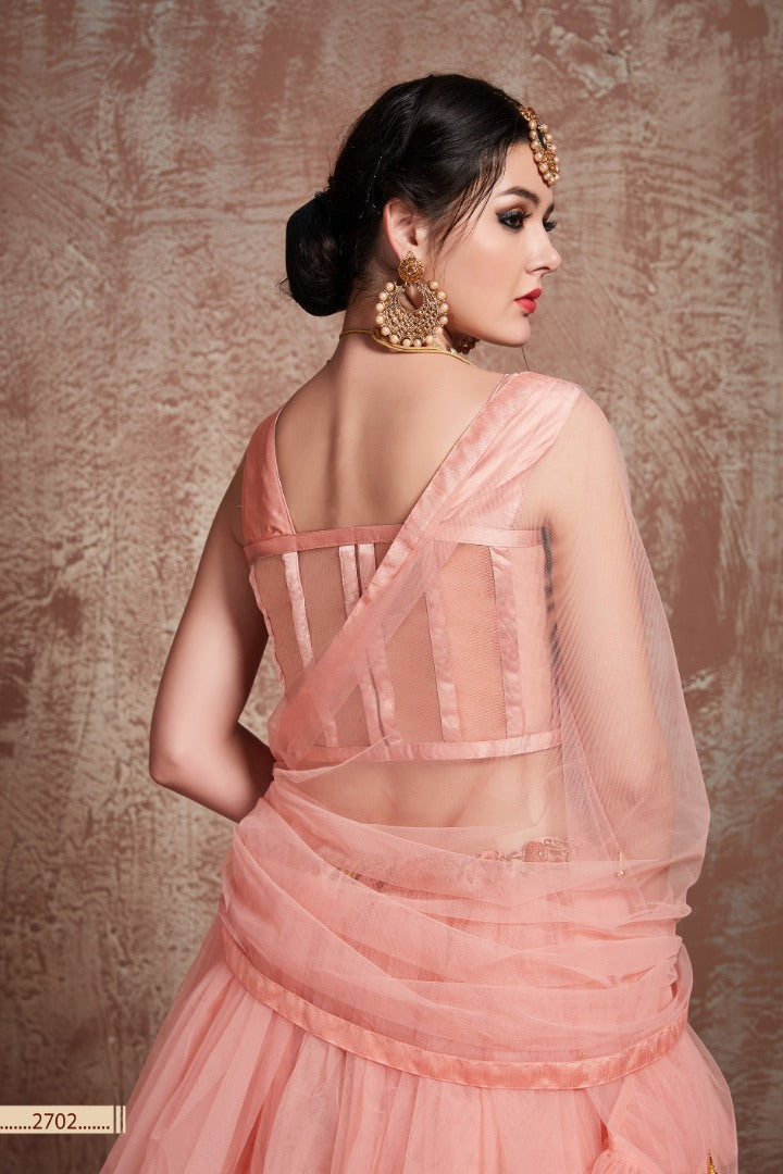 Peach soft net beautiful ruffle layer lehenga for ceremony