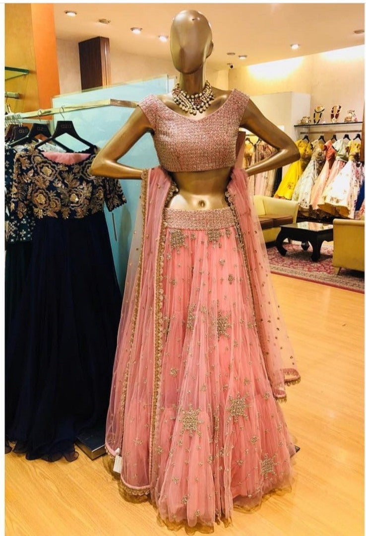 Peach soft net embroidered lehenga choli for ceremony