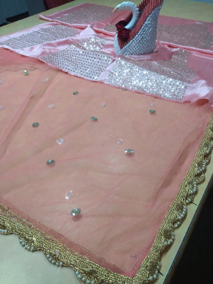 Peach soft net embroidered lehenga choli for ceremony