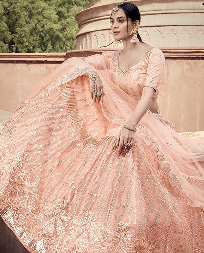 Peach soft net sequence work bridal lehenga choli