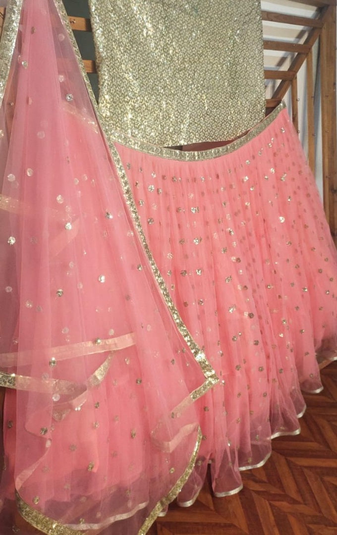 Peach soft net sequence work ceremonial lehenga choli