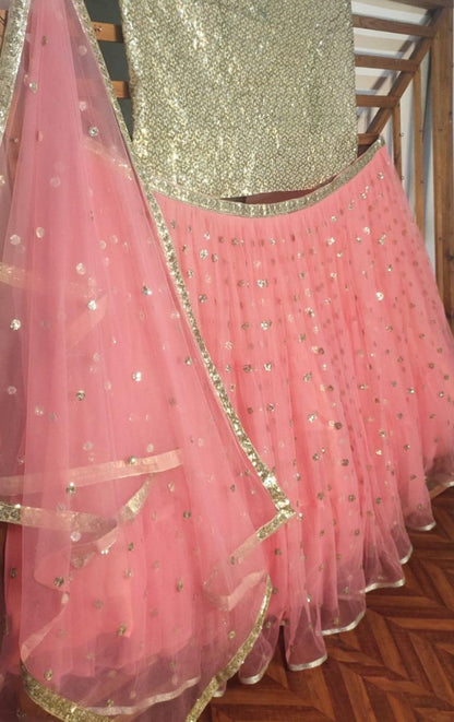 Peach soft net sequence work ceremonial lehenga choli
