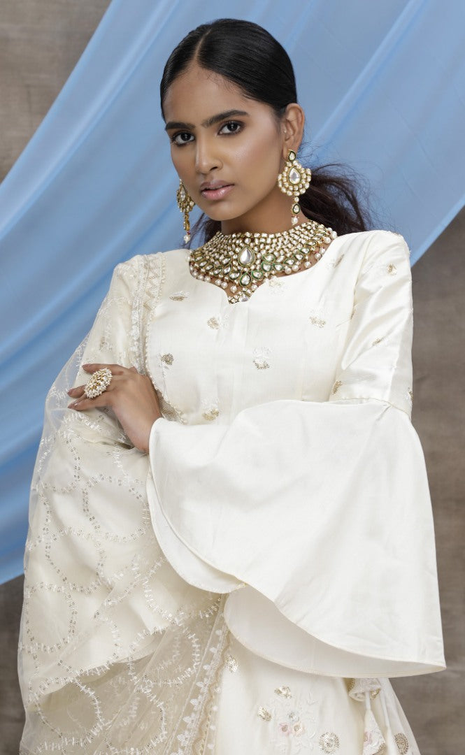 Pearl white silk art embroidered party wear lehenga choli