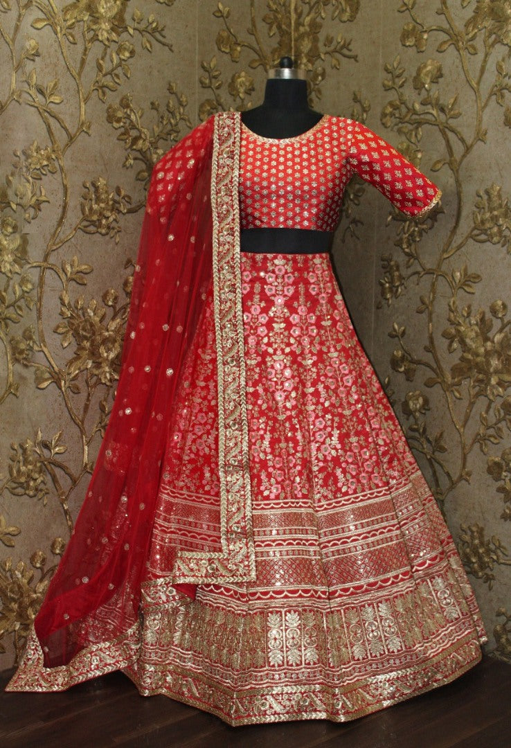 Pink floral embroidery on red base art silk bridal lehenga