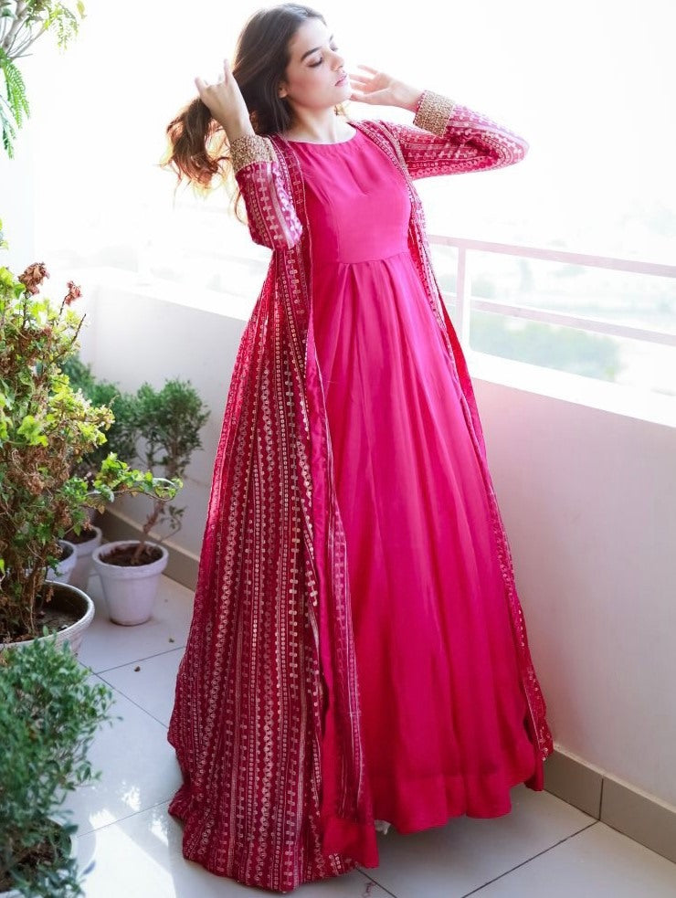 Pink georgette gown with heavy embroidery work koti shrug