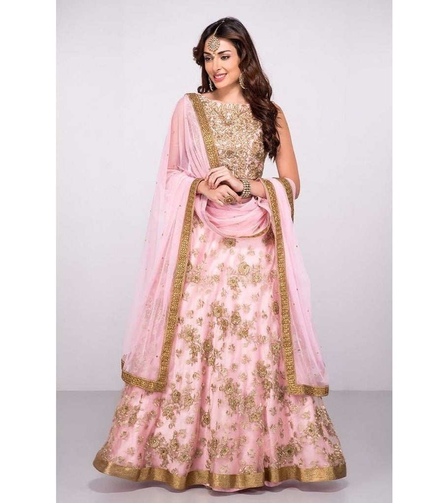 Pink net heavy embroidered wedding lehenga