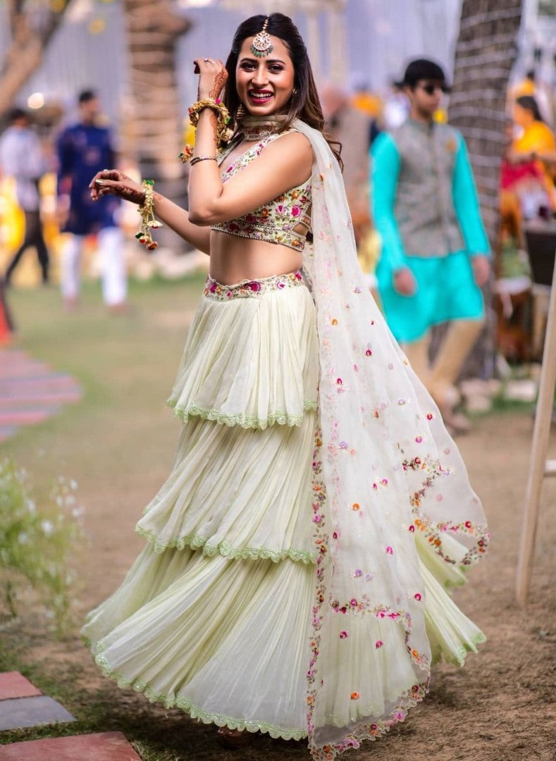Pista green faux georgette ruffle lehenga with embroidered choli