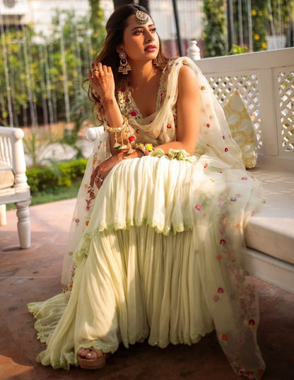 Pista green faux georgette ruffle lehenga with embroidered choli