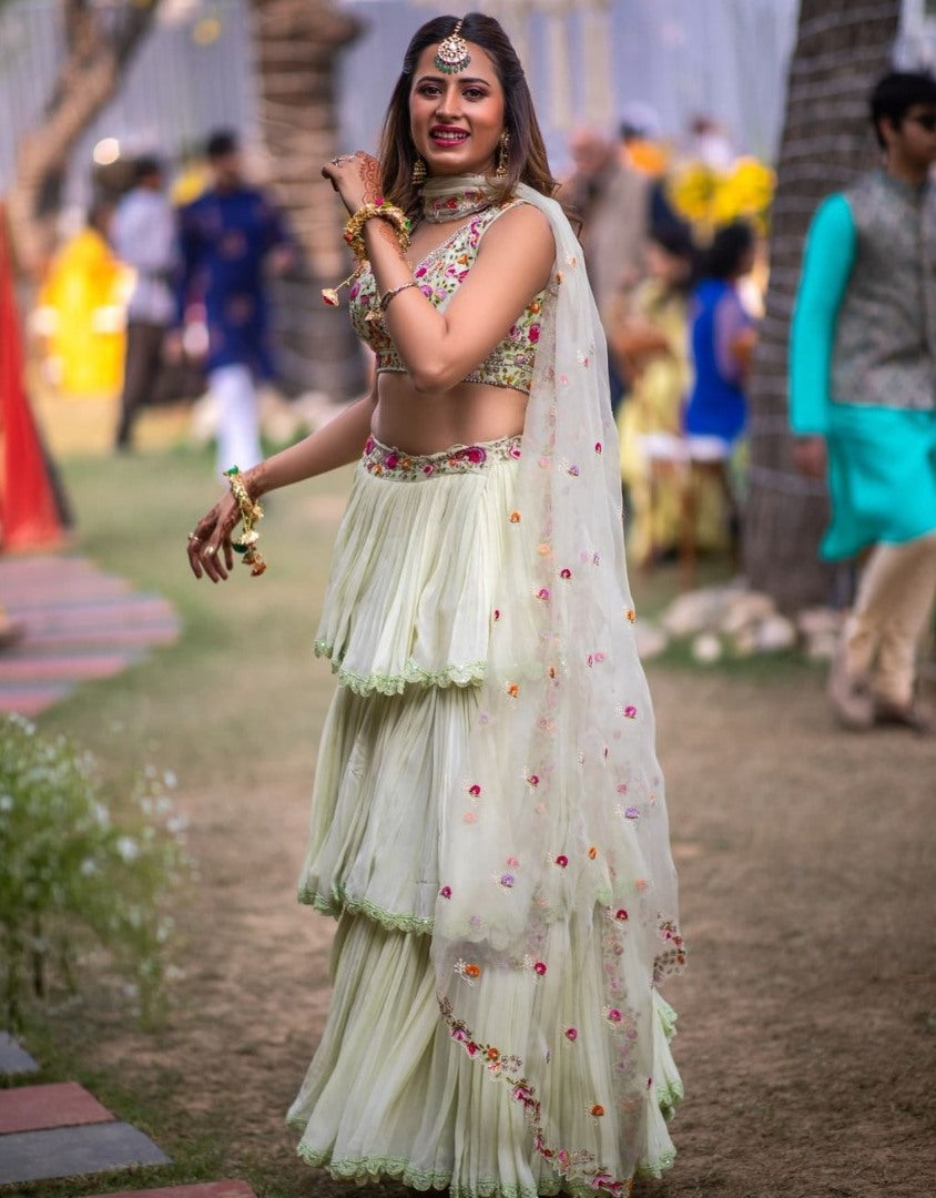 Pista green faux georgette ruffle lehenga with embroidered choli