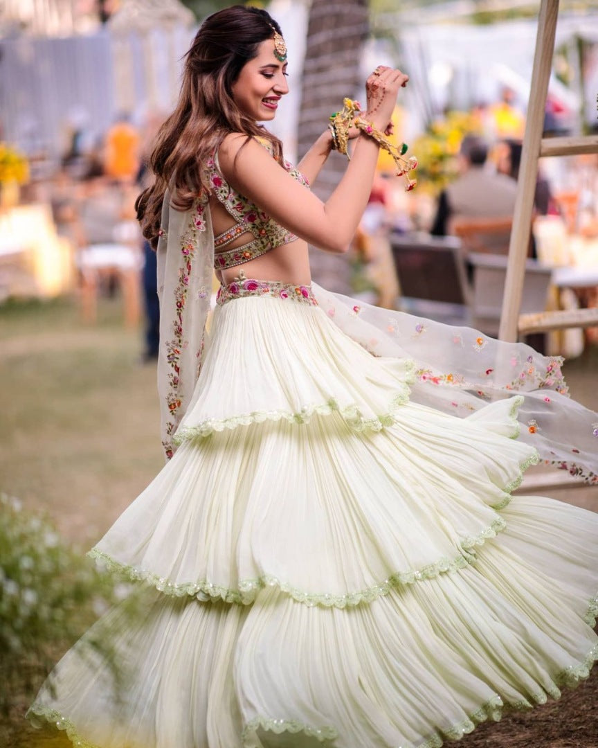 Pista green faux georgette ruffle lehenga with embroidered choli