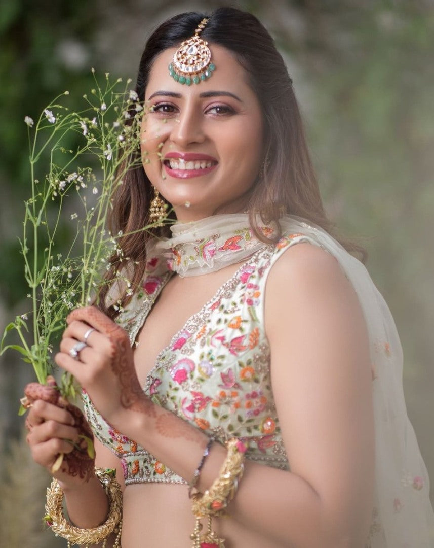 Pista green faux georgette ruffle lehenga with embroidered choli