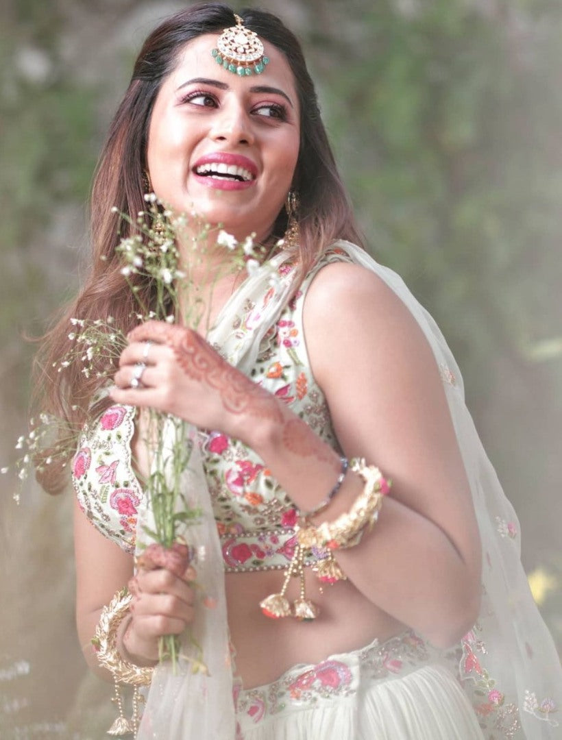 Pista green faux georgette ruffle lehenga with embroidered choli