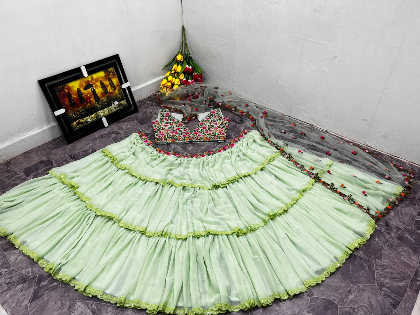 Pista green faux georgette ruffle lehenga with embroidered choli