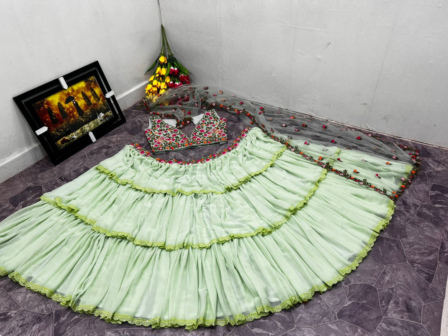 Pista green faux georgette ruffle lehenga with embroidered choli