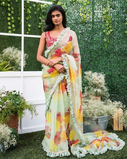 Pista green floral printed georgette saree with ruffle border