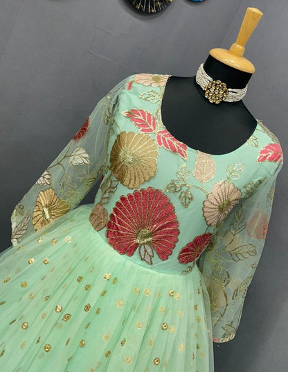 Pista green georgette and soft net embroidered gown