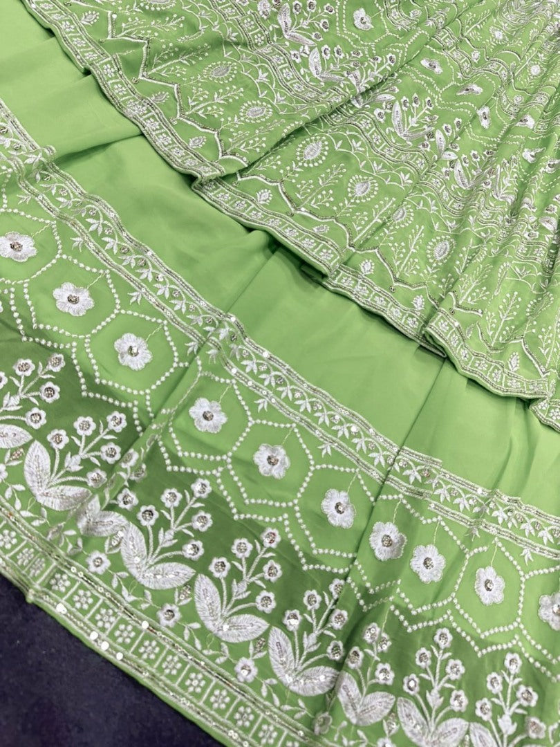 Pista green heavy embroidery worked lehenga suit for wedding ceremony
