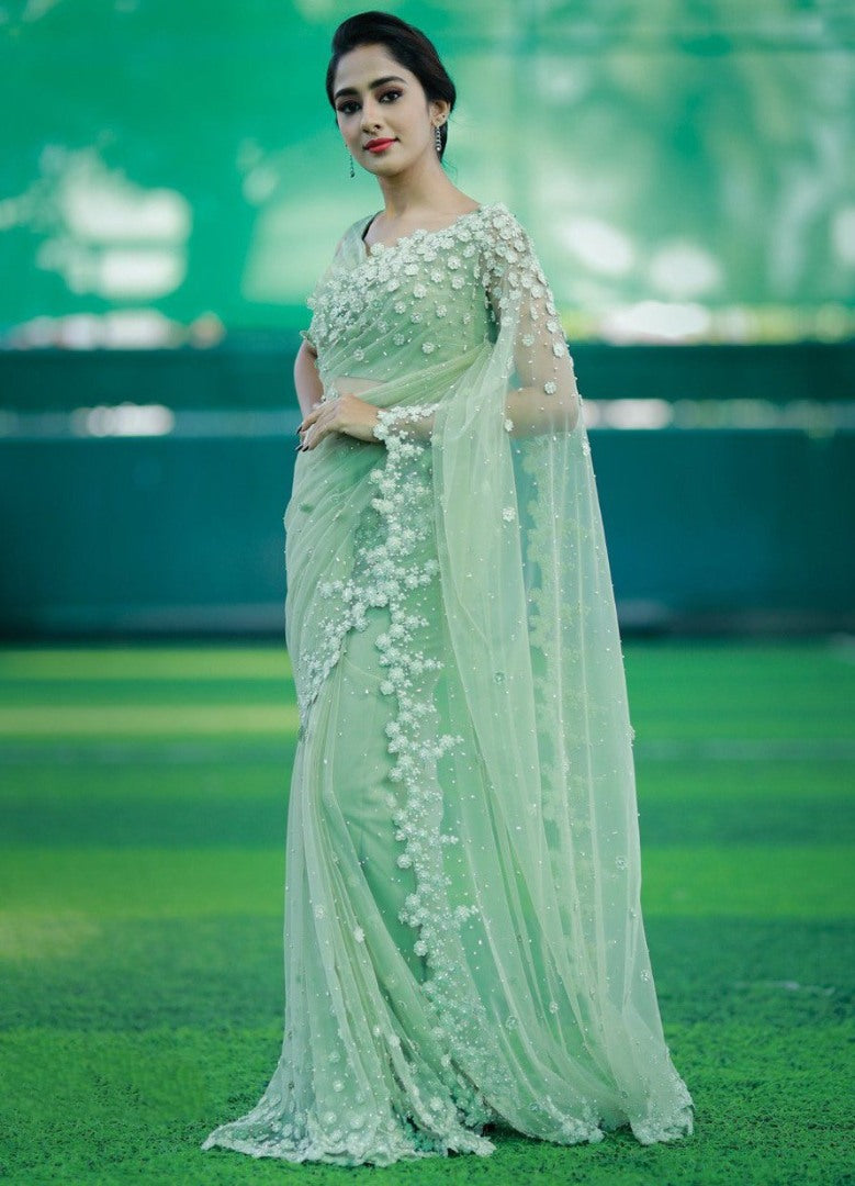 Pista green mono net thread embroidered saree