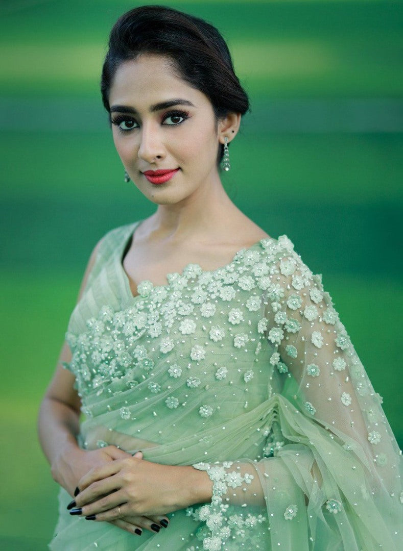 Pista green mono net thread embroidered saree