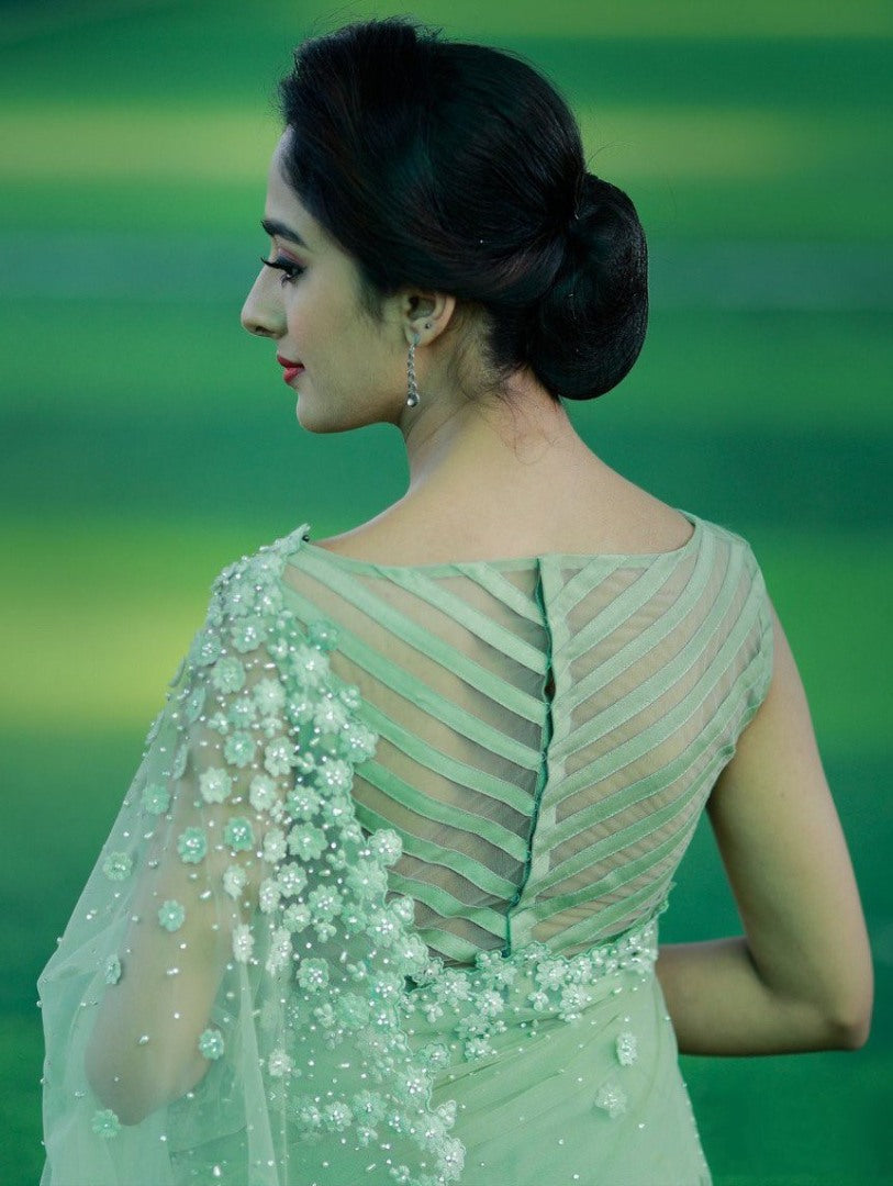 Pista green mono net thread embroidered saree