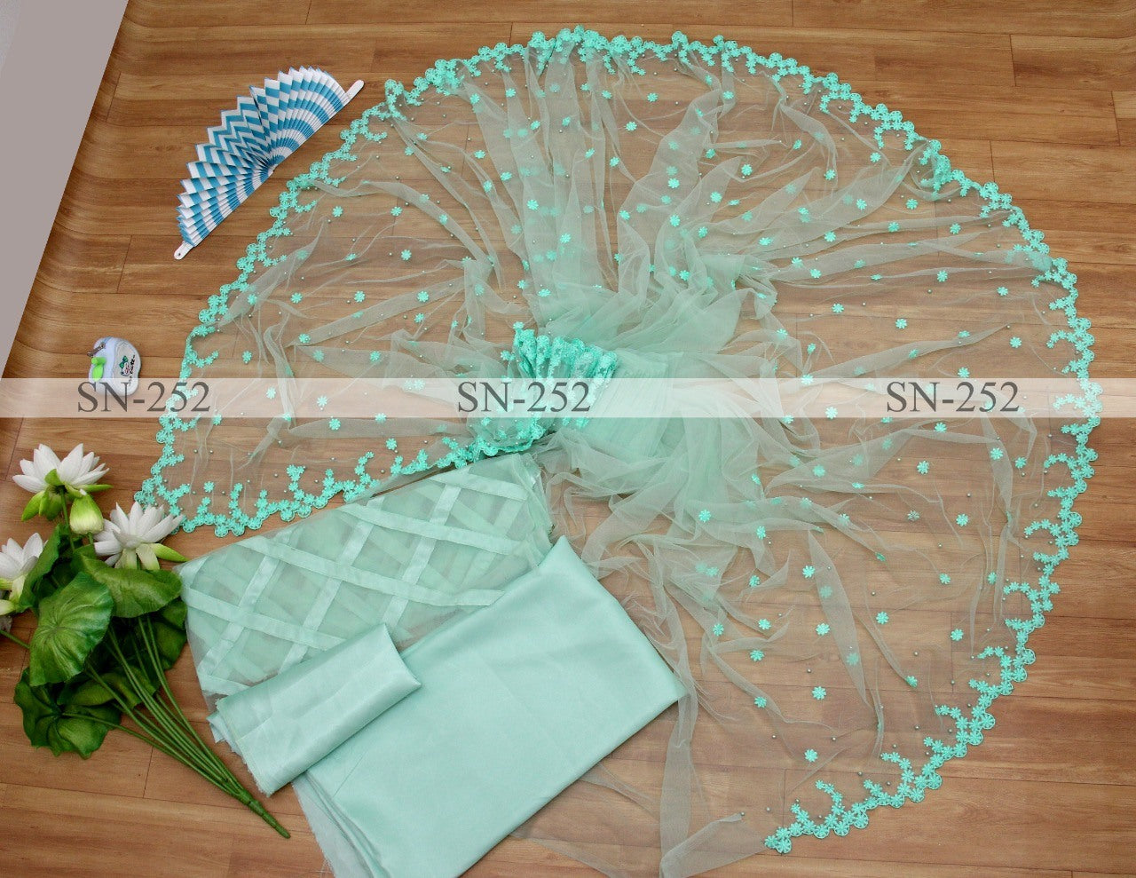 Pista green mono net thread embroidered saree