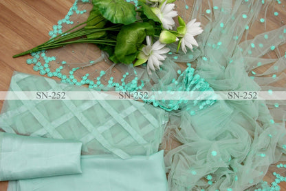 Pista green mono net thread embroidered saree