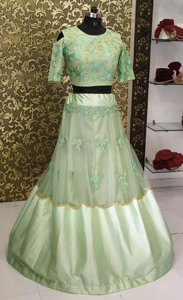 Pista green net and satin fabulous crop top lehenga