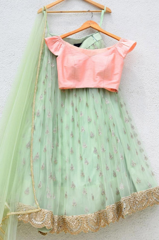 Pista green net embroidery work lehenga choli for ceremony